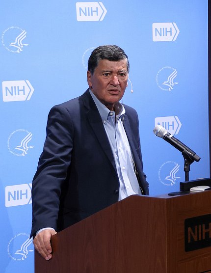 Dr. Elias Zerhouni speaking into mic at podium